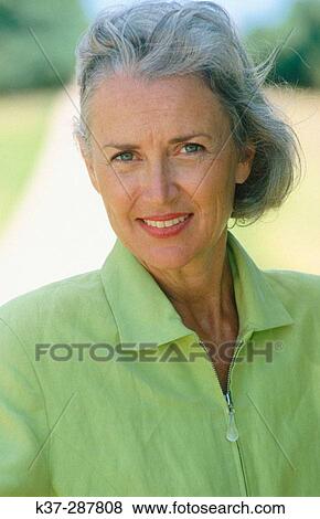 Stock Photo - Smiling mature woman portrait. Fotosearch