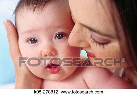 Smiling mother with four month old infant View Large Photo Image Stock Image - Smiling mother with four month old infant. Fotosearch