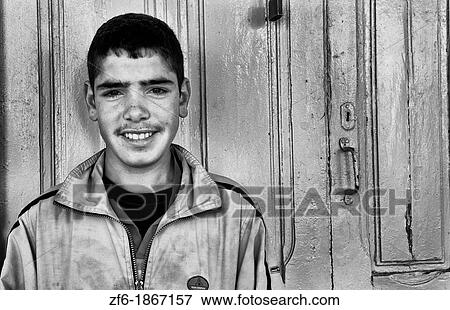 Smiling teenage boy in Testour of Tunisia in Northern Africa View Large Photo Image Stock Photo - Smiling teenage boy in Testour of Tunisia in Northern Africa. Fotosearch