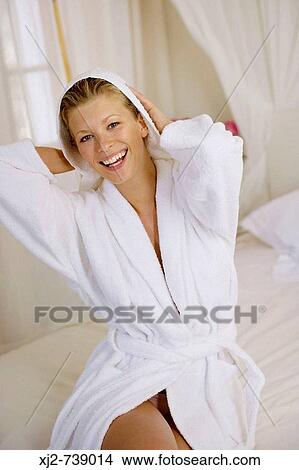 Smiling woman drying her hair with a towel View Large Photo Image Picture - Smiling woman drying her hair with a towel. Fotosearch