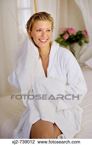 Smiling woman drying her hair with a towel View Large Photo Image Stock Image - Smiling woman drying her hair with a towel. Fotosearch