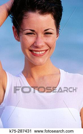 Stock Image - Smiling woman. Fotosearch