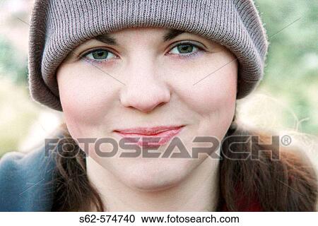 Stock Image - Smiling Woman Wearing Tuque. Fotosearch