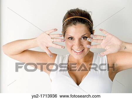 Smiling woman with colorful sprinkles on her hands View Large Photo Image Stock Photograph - Smiling woman with colorful sprinkles on her hands. Fotosearch