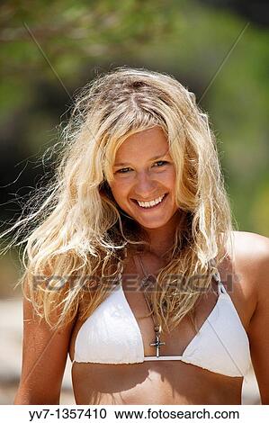 Smiling young blonde woman with a white bikini View Large Photo Image Stock Image - Smiling young blonde woman with a white bikini. Fotosearch