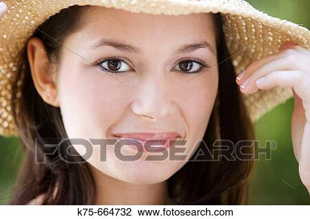 smiling young woman in straw hat View Large Photo Image Stock Image - smiling young woman in straw hat. Fotosearch