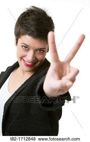 smiling young woman with a look of satisfaction on a white background View Large Photo Image Stock Photo - smiling young woman with a look of satisfaction on a white background. Fotosearch