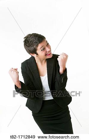 smiling young woman with a look of success on white background View Large Photo Image Stock Photo - smiling young woman with a look of success on white background. Fotosearch