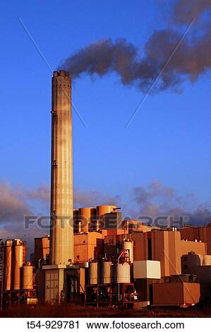 Smoke rises from the chimney of a factory View Large Photo Image Stock Image - Smoke rises from the chimney of a factory. Fotosearch