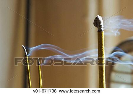 Smoke rising from incense View Large Photo Image Stock Photo - Smoke rising from incense. Fotosearch