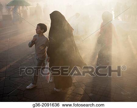 Smoke shrouded marketplace in Djemaa el-Fna square, (the main square) in the Medina in Marrakesch, Morrocco. View Large Photo Image Stock Photograph - Smoke shrouded marketplace in Djemaa el-Fna square, (the main square) in the Medina in Marrakesch, Morrocco.. Fotosearch