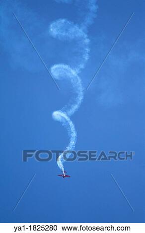 Smokes trace of a spin flight of an aerobatic plane during airshow, Germany View Large Photo Image Stock Image - Smokes trace of a spin flight of an aerobatic plane during airshow, Germany. Fotosearch