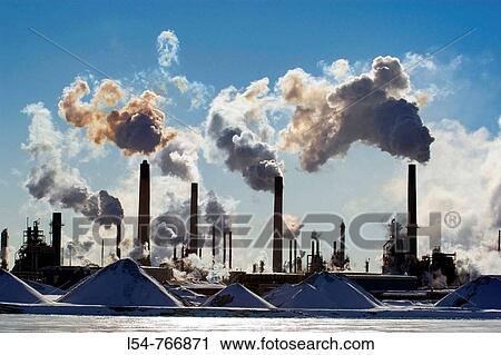 smokestacks spew air pollution at an industrial complex View Large Photo Image Stock Image - smokestacks spew air pollution at an industrial complex. Fotosearch