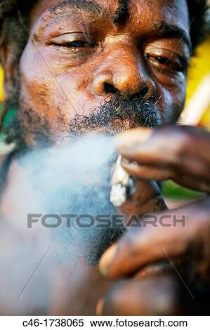 Smoking a joint? Marijuana?, Port Antonio, Jamaica, West Indies, Caribbean, Central America. View Large Photo Image Stock Photography - Smoking a joint? Marijuana?, Port Antonio, Jamaica, West Indies, Caribbean, Central America.. Fotosearch