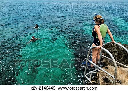 Stock Image - Snorkeling in the tropical aqua waters of Negril, Jamaica.. Fotosearch