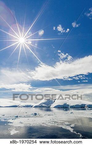 Snow-capped mountains surround Mickelson Harbor, Antarctica, Southern Ocean. View Large Photo Image Picture - Snow-capped mountains surround Mickelson Harbor, Antarctica, Southern Ocean.. Fotosearch
