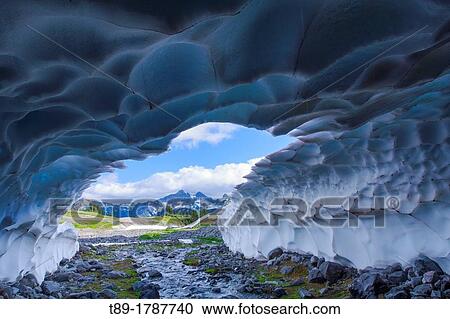 Stock Image - Snow cave in the spring, Mt Rainier, Washington, USA.. Fotosearch