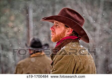Snow coming down on cowboy View Large Photo Image Picture - Snow coming down on cowboy. Fotosearch
