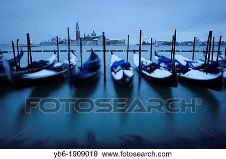 Snow covered gondolas seen at Venice's waterfront during the heavy snowfall and severe weather in Venice View Large Photo Image Stock Photo - Snow covered gondolas seen at Venice's waterfront during the heavy snowfall and severe weather in Venice. Fotosearch