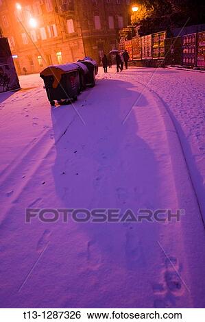 Snow covered street, long shadow from a trash cart. Rijeka, Croatia. View Large Photo Image Stock Photograph - Snow covered street, long shadow from a trash cart. Rijeka, Croatia.. Fotosearch