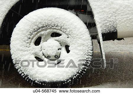 Snow covered wheel, SLC, Utah. USA. View Large Photo Image Stock Photography - Snow covered wheel, SLC, Utah. USA.. Fotosearch