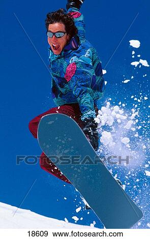 Snowboarding on a sunny day View Large Photo Image Stock Photo - Snowboarding on a sunny day. Fotosearch