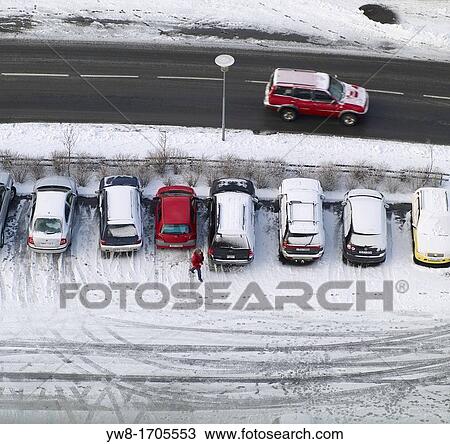 Stock Image - Snowy winter parking lot, Reykjavik, Iceland. Fotosearch