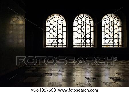 Stock Photo - Sofia, Bulgaria. Darkness and light, within the interior of Sofia's Alexander Nevski Cathedral, seat of the Bulgarian Patriarch.. Fotosearch