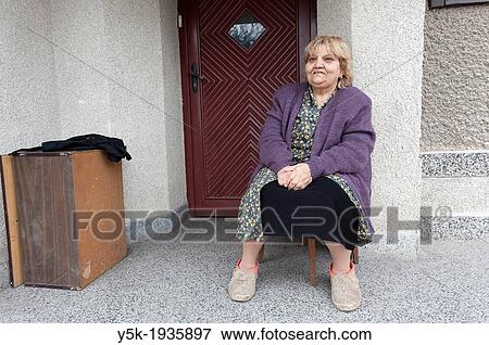 Stock Photo - Sofia, Bulgaria. Older Bulgarian woman, spending time at home.. Fotosearch