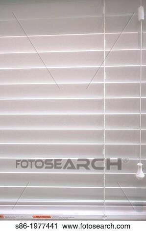 Stock Image - Soft Light Through A Closed Venetian Window Blind.. Fotosearch