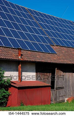 Solar panels on the roof of an old farm View Large Photo Image Stock Photography - Solar panels on the roof of an old farm. Fotosearch