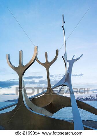 Picture - Solfar, a landmark of Reykjavik. Solfar icelandic for Sun Voyager is a sculture made of stainless steel in the harbour of Reykjavik made be the artist Jon Gunnar Arnason. europe, northern europe, iceland, February.. Fotosearch