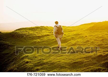 Solitary hiker on Eggardon Hill, Dorset, Uk View Large Photo Image Stock Photo - Solitary hiker on Eggardon Hill, Dorset, Uk. Fotosearch