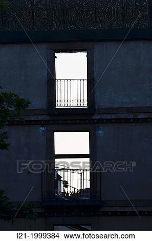 Picture - Solitary wall with windows of a house about to be demolished.. Fotosearch