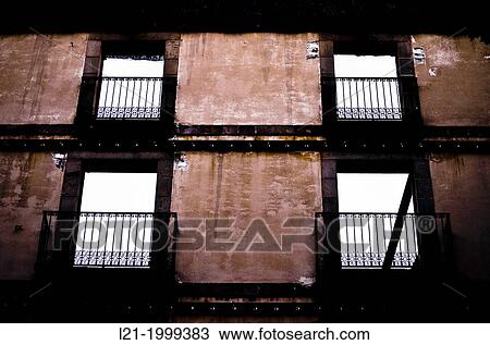 Solitary wall with windows of a house about to be demolished. View Large Photo Image Stock Image - Solitary wall with windows of a house about to be demolished.. Fotosearch