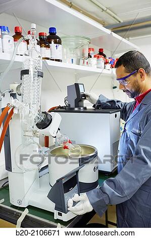 Stock Image - Solvent evaporation. Rotary evaporator. Laboratory characterization. Tecnalia Research and Innovation. Donostia. San Sebastian. Gipuzkoa. Basque Country. Spain. Europe.. Fotosearch