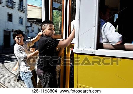 some kids ride free on the tram. Lisbon, Portugal View Large Photo Image Picture - some kids ride free on the tram. Lisbon, Portugal. Fotosearch