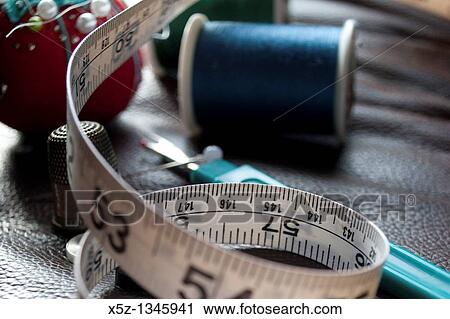 Some measuring tape and assorted sewing box items View Large Photo Image Stock Image - Some measuring tape and assorted sewing box items. Fotosearch