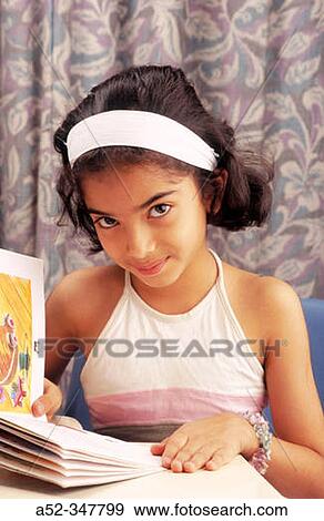South Asian Girl reading a book View Large Photo Image Stock Photo - South Asian Girl reading a book. Fotosearch