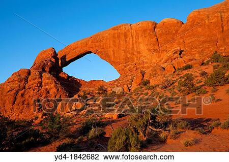 Stock Image - South Window Water and ice, extreme temperatures, and underground salt movement are responsible for the scultured rock scenery of Arches National Park. Fotosearch
