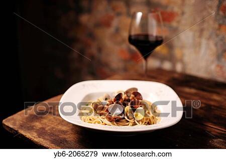 Stock Photo - Spaghetti with clams, La Mascareta Restaurant, Venice, Italy.. Fotosearch