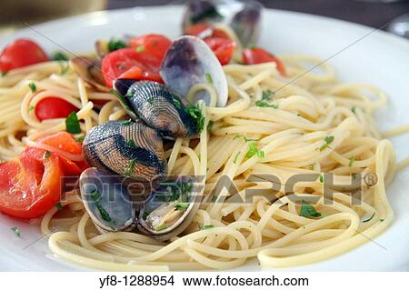 Spaghetti with frutti di mare. Santa Teresa di Gallura in Sardinia, Italy. View Large Photo Image Picture - Spaghetti with frutti di mare. Santa Teresa di Gallura in Sardinia, Italy.. Fotosearch
