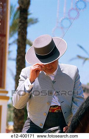 Stock Image - Spain. Andalusia. Jerez de la Frontera. Feria, feast of horses. Man with andalusian cow boy dress. Fotosearch