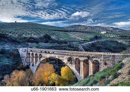 Stock Image - Spain, Andalusia, Scenic landscape with bridge. Fotosearch