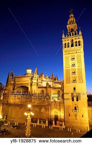 Spain, Andalusia, Sevilla cathedral, Giralda tower at dusk View Large Photo Image Stock Photography - Spain, Andalusia, Sevilla cathedral, Giralda tower at dusk. Fotosearch
