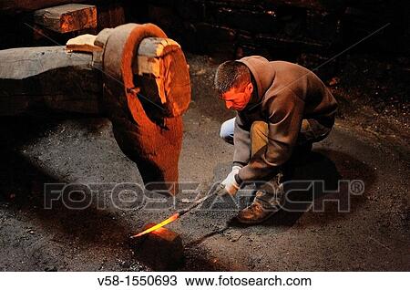 Spain, Asturias, Taramundi, Os Teixois ethnographic museum, Blacksmith at work The huge hammer seen here is moved by a water mill. View Large Photo Image Stock Image - Spain, Asturias, Taramundi, Os Teixois ethnographic museum, Blacksmith at work The huge hammer seen here is moved by a water mill.. Fotosearch
