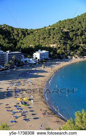 Spain, Balearic Islands, Ibiza, Cala Sant Vicent bay and resort View Large Photo Image Stock Photo - Spain, Balearic Islands, Ibiza, Cala Sant Vicent bay and resort. Fotosearch