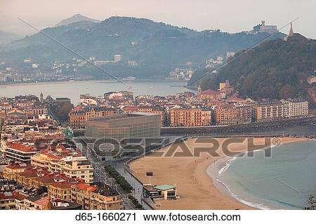 Spain, Basque Country Region, Guipuzcoa Province, San Sebastian, elevated view of town and Kursaal convention center from Monte Ulia, dawn View Large Photo Image Stock Image - Spain, Basque Country Region, Guipuzcoa Province, San Sebastian, elevated view of town and Kursaal convention center from Monte Ulia, dawn. Fotosearch