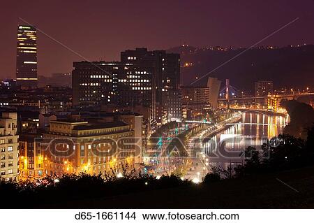 Picture - Spain, Basque Country Region, Vizcaya Province, Bilbao, elevated city view from Parque Etxebarria park, evening. Fotosearch