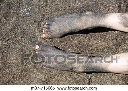 Spain. Canary islands. Gran Canaria. Las Palmas. Las Canteras beach. Volcanic sand on feet. View Large Photo Image Stock Photography - Spain. Canary islands. Gran Canaria. Las Palmas. Las Canteras beach. Volcanic sand on feet.. Fotosearch